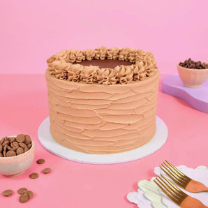 Vegan Chocolate Cake with smooth chocolate vegan buttercream, freshly baked in London by Crumbs & Doilies.
